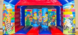 Bright vibrant bouncy castle with bright brick theme.