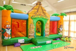 Large inflatable indoors. with jungle animals and palm trees.