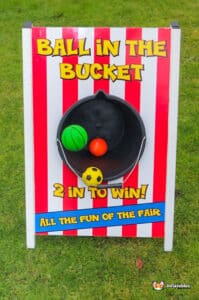 A colorful ball resting inside a bucket, showcasing a playful scene of fun and leisure.