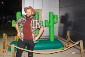 A large inflatable cactus stands outside, promoting a lasso game for visitors to enjoy.