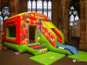 Brightly coloured inflatable with circus theme.