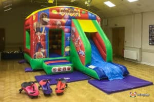 Plasma cars, Crash mats and a brightly themed bouncy castle.