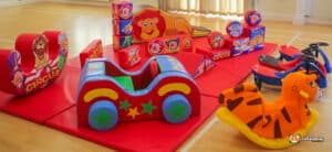 A colorful circus-themed soft play area with engaging toys and play structures for children to enjoy and explore.