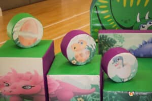 A collection of colorful boxes featuring cartoon characters, branded with "Dino Soft Play" for a playful atmosphere.