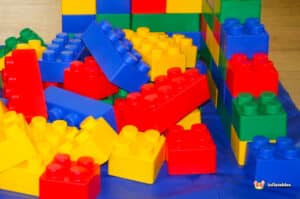 A vibrant pile of Edublocks Lego bricks in various colors, showcasing creativity and playfulness.