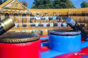 An inflatable bouncer designed for gladiator duels, featuring colorful walls.