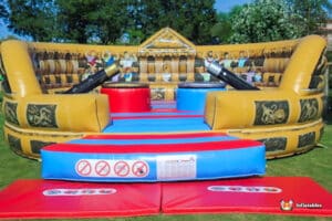 A vibrant inflatable bouncer designed for gladiator duels, showcasing bright colors.