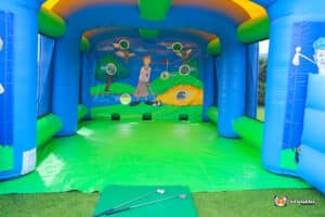 Inflatable game set up outdoors, featuring targets for players to aim at with golf balls.