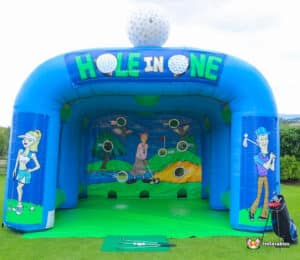 A colorful inflatable bouncer with a golf challenge, highlighting a hole-in-one target for engaging gameplay.