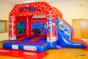 A hero-themed bouncy castle showcasing Spider hero , perfect for kids to enjoy jumping and sliding in a fun atmosphere.