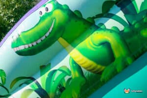 Cartoon artwork of a crocodile on an inflatable.
