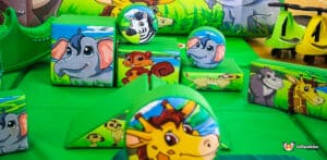 Jungle-themed soft play area filled with plush animal toys and engaging structures for children's imaginative play.