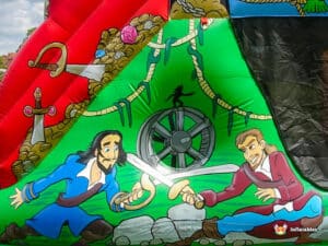 A vibrant inflatable pirate-themed artwork featuring two sword-fighting characters amidst treasure and vibrant colors.