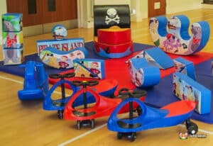 A vibrant pirate-themed play area filled with soft toys and climbing structures designed for children's fun and adventure.