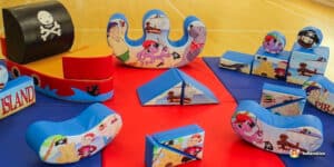A lively pirate-themed soft play area equipped with toys and structures, inviting children to engage in creative play.