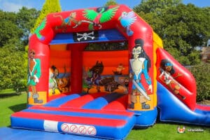 A vibrant bouncy castle adorned with cheerful cartoon characters, perfect for children's entertainment and enjoyment.