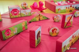 A vibrant pink play area filled with pink toys, featuring a cute pink horse, perfect for little princesses to enjoy.