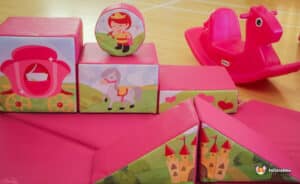 A pink play set featuring a princess and a horse, designed for imaginative play and fun adventures.