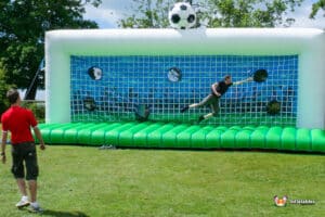 Inflatable soccer goal set up for a penalty shootout, featuring bright colors and a fun, playful design.