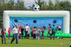 Inflatable soccer goal set up for a penalty shootout, ready for players to practice their shooting skills.