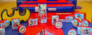 Bright play area filled with toys and a toy car, inviting kids to explore at Superhero Soft Play.
