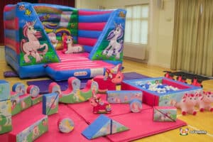 Unicorn Bouncer and soft play package in vibrant colours.