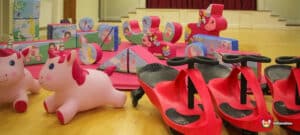 A cheerful display of toys, prominently featuring a pink unicorn horse, perfect for sparking creativity and joy.