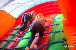 Children climbing a cargo net.