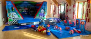 Abbots Morton village hall with auto bouncer and plasma cars.
