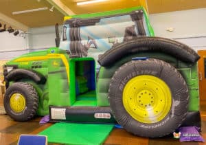 Ashton Under Hill Village Hall with Tractor bouncy castle from BBC Inflatables.