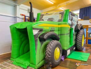 Ashton Under Hill Village Hall Tractor themed bouncy castle contact BBC Inflatables for hire.