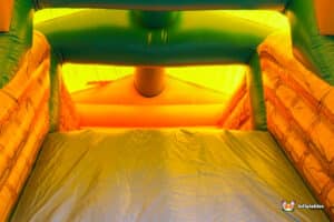 Large inflatable with a jungle theme, featuring bright colours and designs.