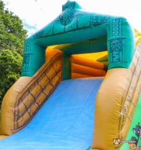 Vibrant inflatable jungle slide, part of the Fun Run 2, inviting participants to enjoy the jungle adventure.