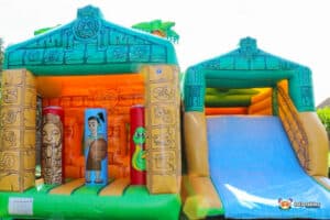 Inflatable jungle slide featuring a vibrant jungle theme, complete with a fun slide and Aztec Maze design.
