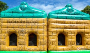 "Aztec Maze" inflatable bouncer featuring a jungle theme, complete with bright colors and playful animal designs for children.