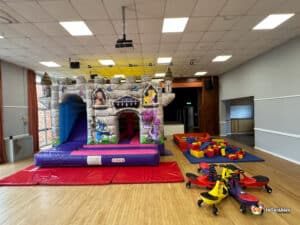 castle themed bouncy castle with soft play bricks and plasma cars
