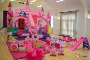girls bouncy castle with unicorn hoppers and plasma cars