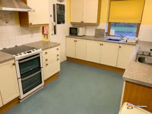 Kitchen with oven and microwave
