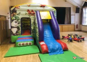 bouncy castle with jungle theme and plasma cars.