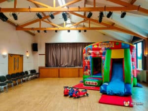 Circus bouncy castle in hall with wooden beams