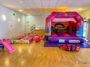 Princess themed bouncy castle pink soft play and plasma cars