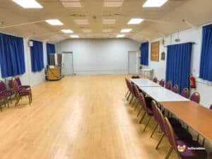 Main hall with tables and chairs set up.
