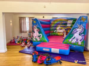 Unicorn themed bouncy castle