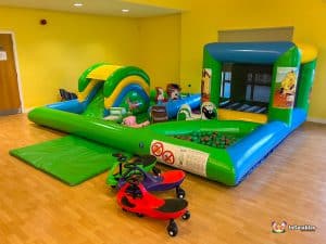 Low bouncy castles suitable for toddlers with soft play and plasma cars.