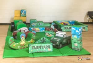 Farm themed soft play with land rovers and hay bales