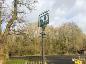Sign post at the front of hall.
