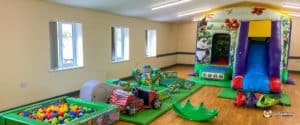 Jungle themed bouncy castle with matching soft play.