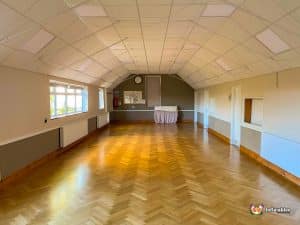 Empty hall with wooden flooring.