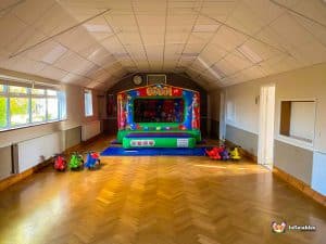 Circus themed bouncy castle with clowns.