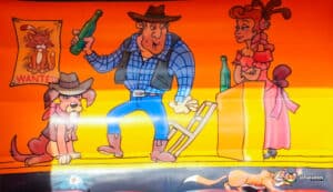 Cartoon characters decorate a lively Western-themed bouncy castle, creating a fun cowboy themed party for kids to enjoy.